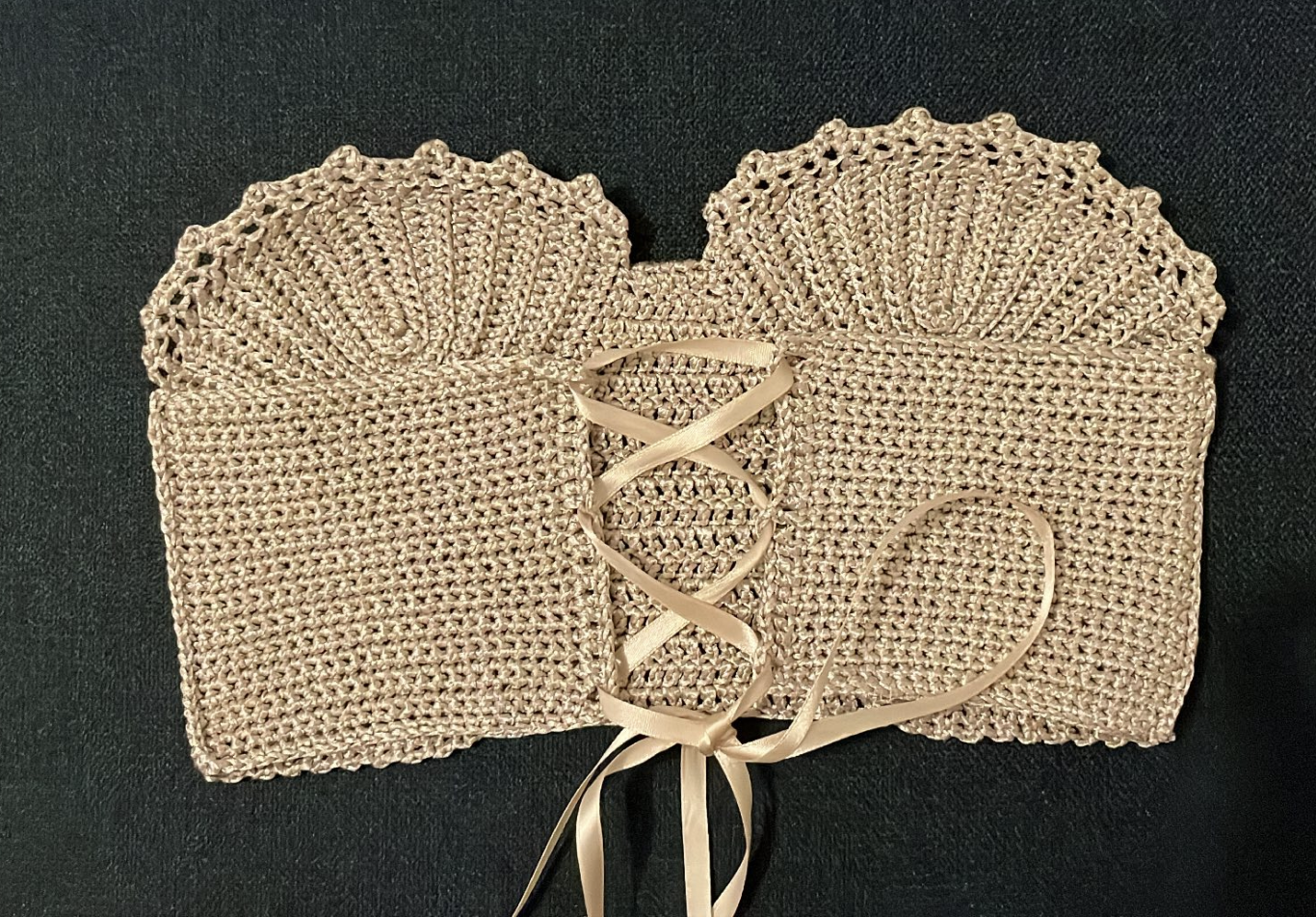 Surena Crochet conchita corset bustier top laid flat, a handmade summery top
