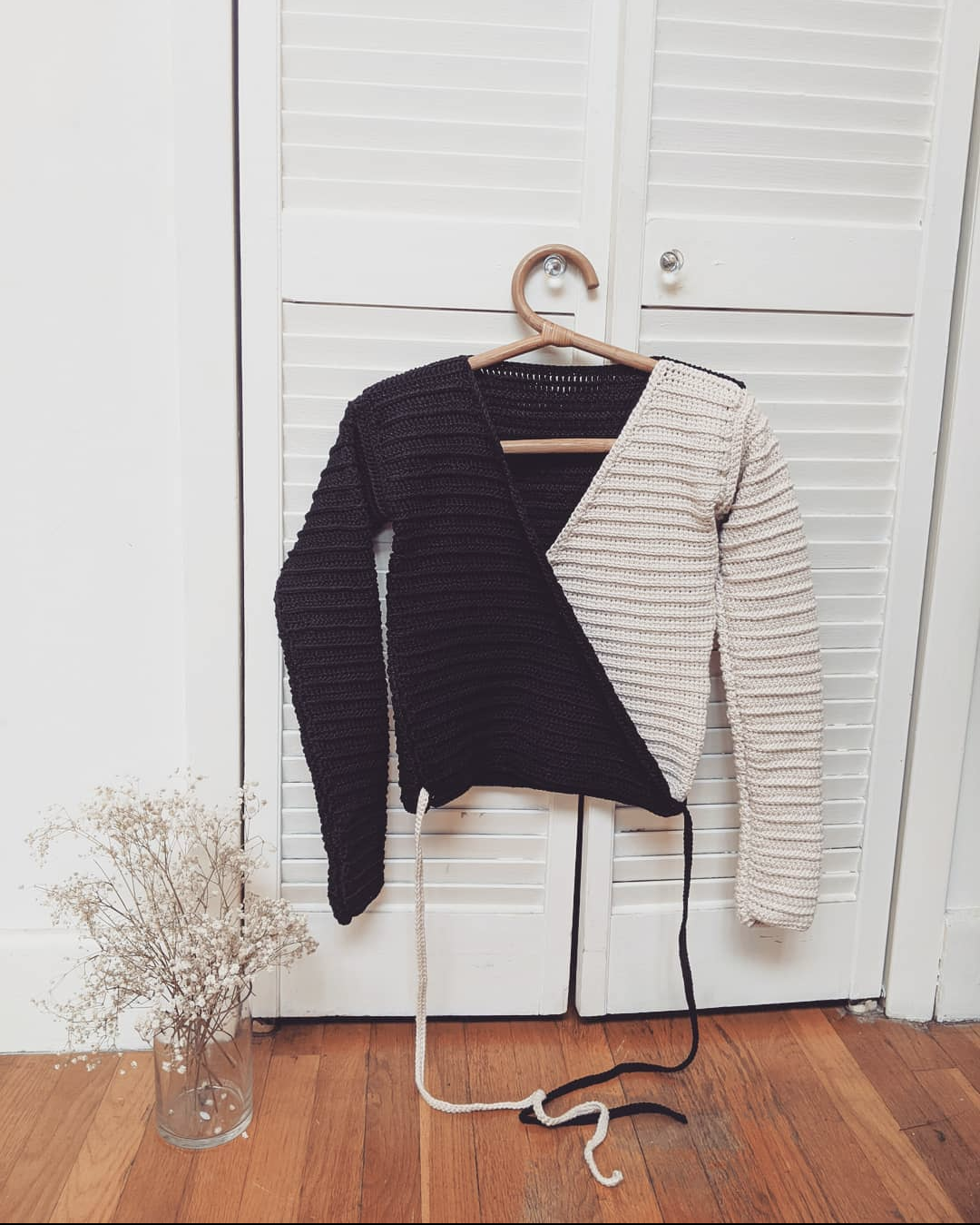 Detail of the Surena crochet ballerina wrap top in black and beige