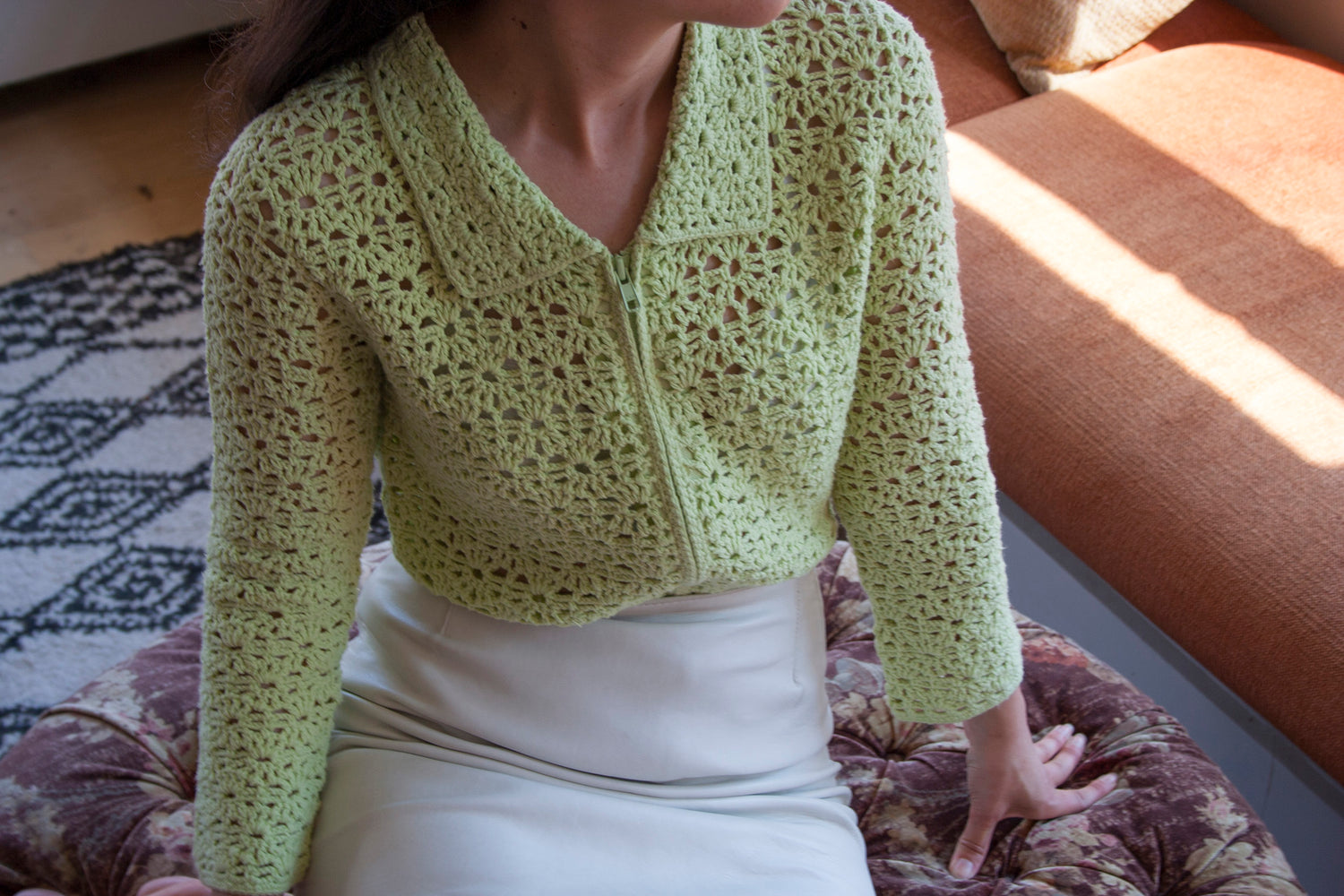 Model wearing the surena crochet preloved flower garden zippered crochet cardigan, in mint green.