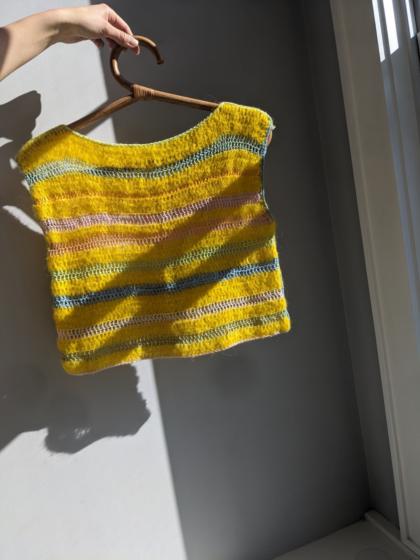 Back of the yellow cloud top, a breezy and soft top handmade with alpaca, silk and cotton yarns.