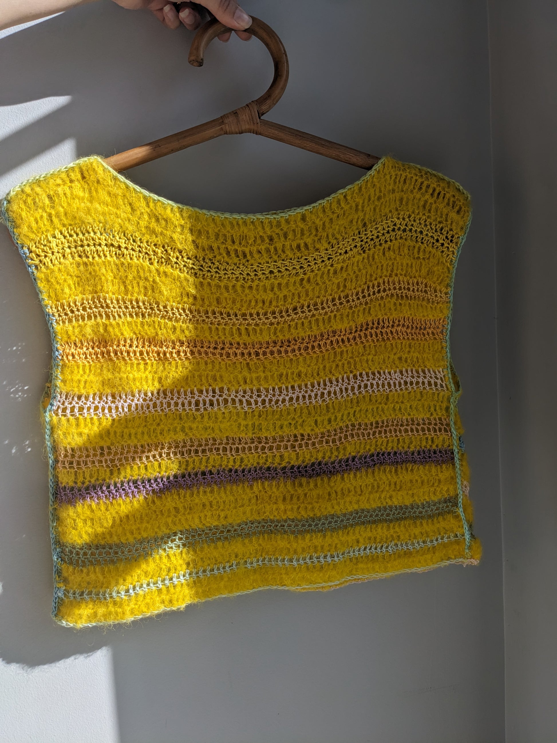 Front of the yellow cloud top, a breezy and  soft top handmade with alpaca, silk and cotton yarns.
