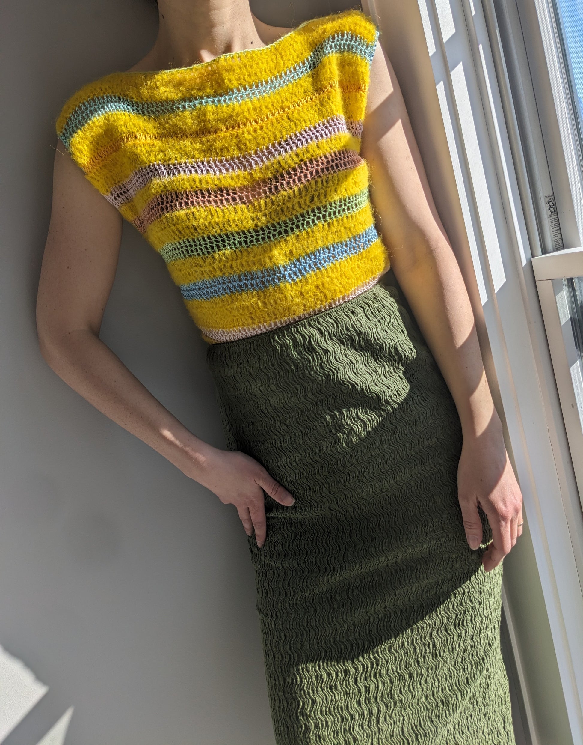 Model wearing the Surena crochet cloud top in yellow.