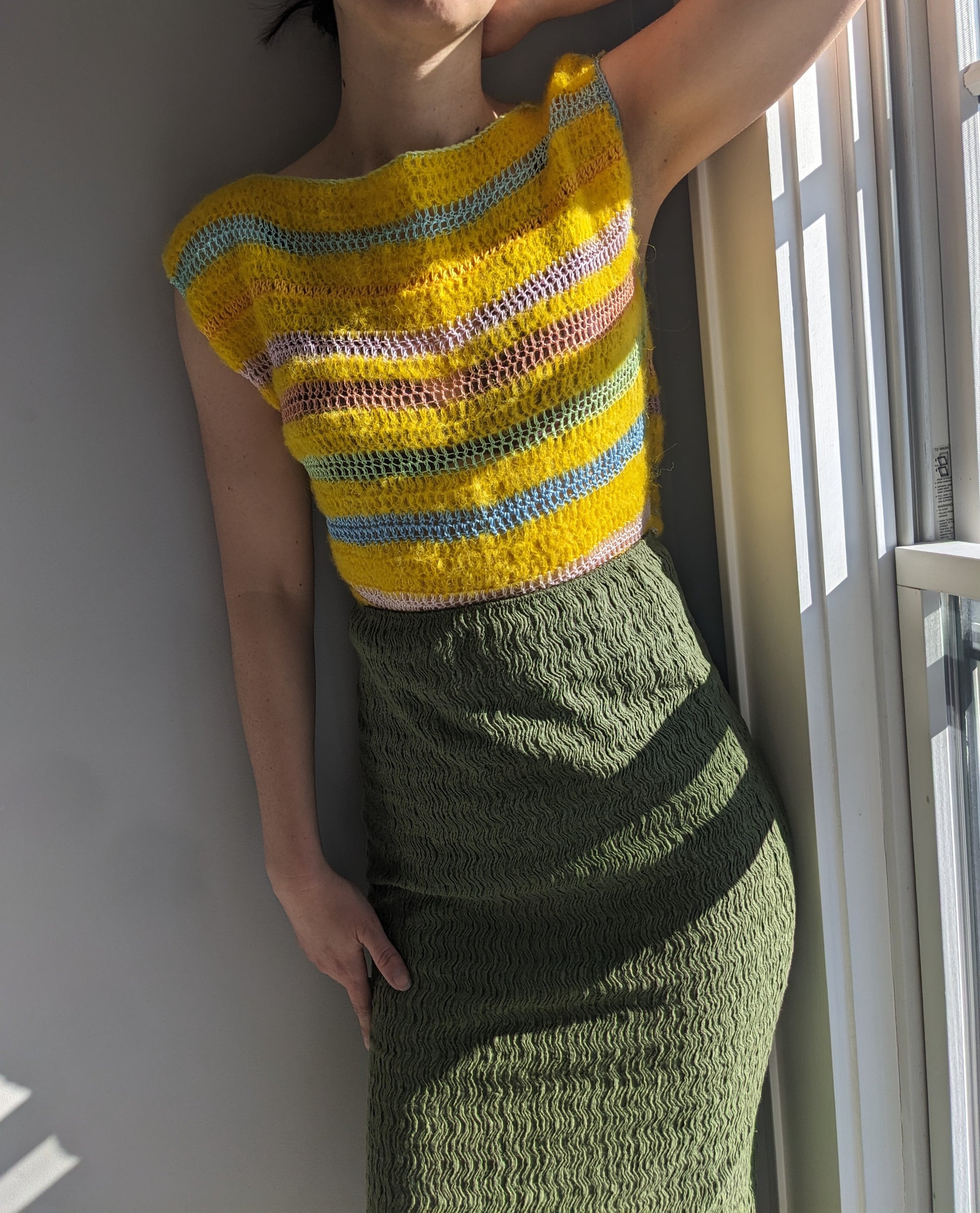 Model wearing the Surena crochet cloud top in yellow.