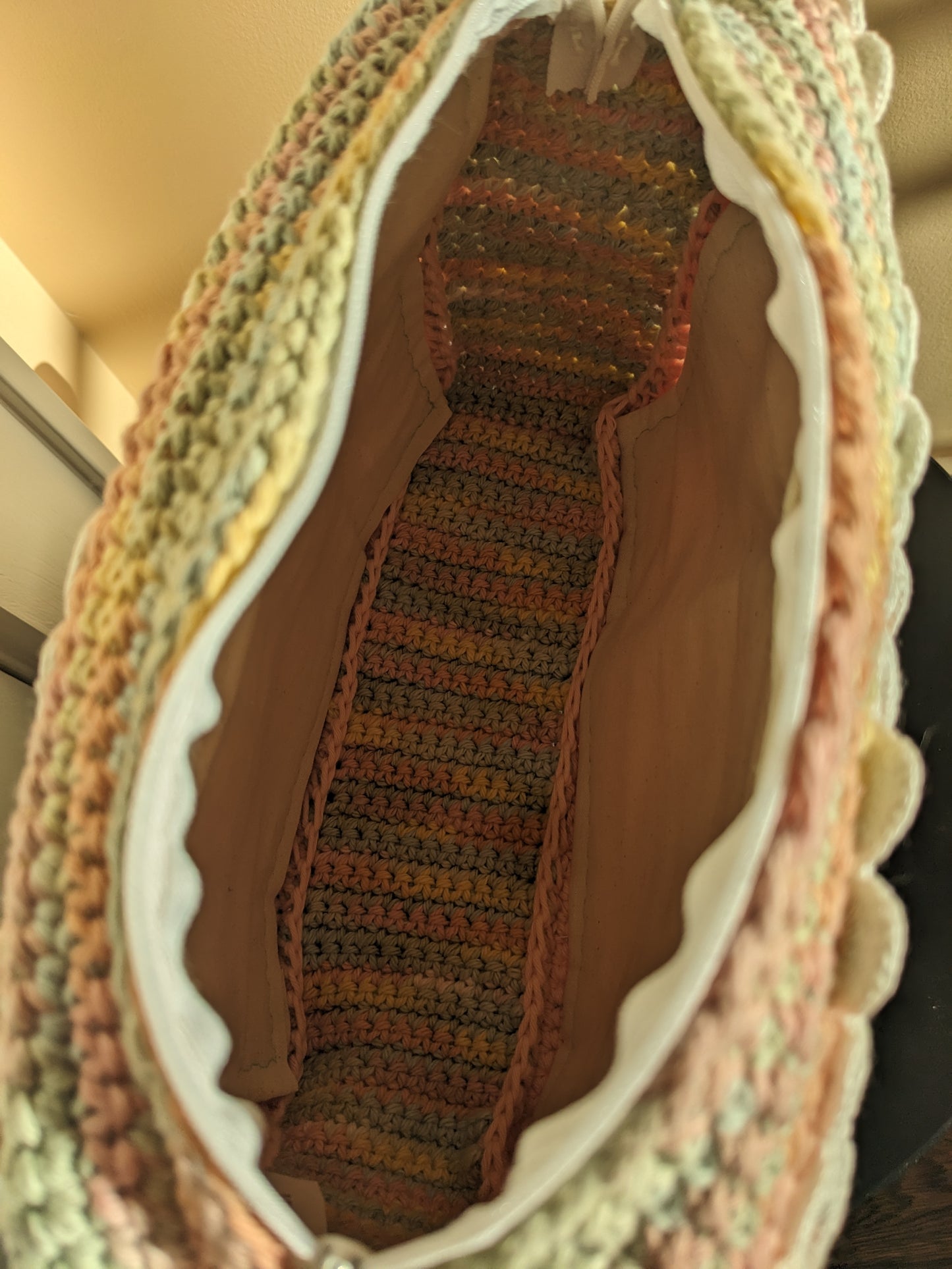 Close up of an upcycled crochet clutch