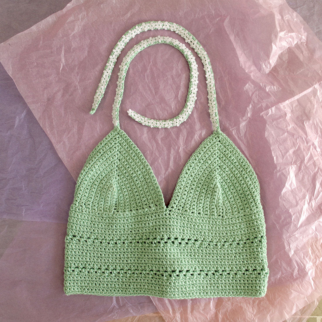 Surena crochet margarita top in mint green and laid flat, a handmade crochet top custom made with cotton yarn.