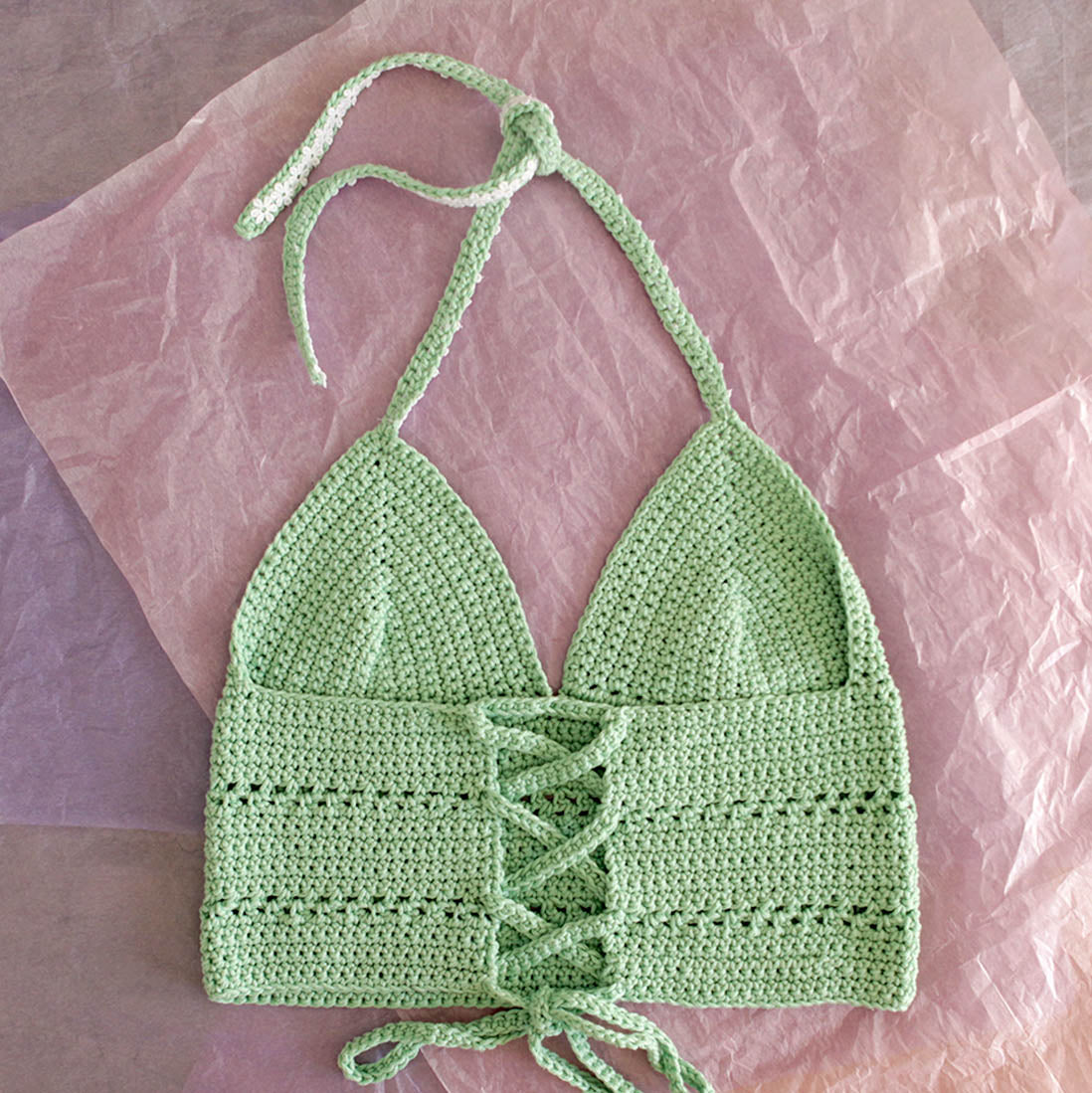 Surena crochet margarita top in mint green and laid flat, a handmade crochet top custom made with cotton yarn.