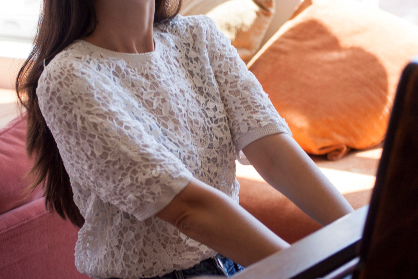 Model wearing the white crochet beaded shirt