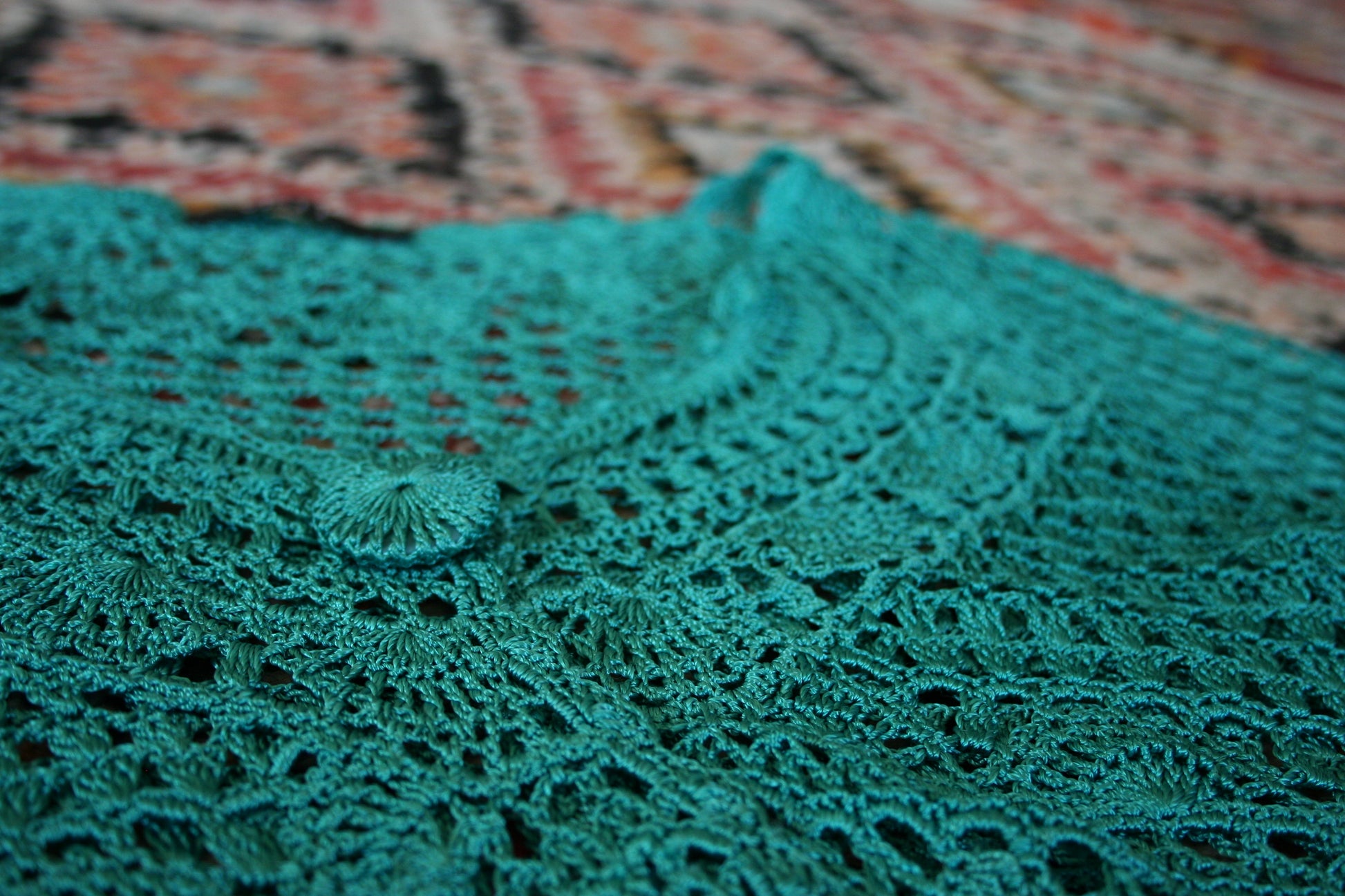 Detail of the preloved turquoise boho crochet vest