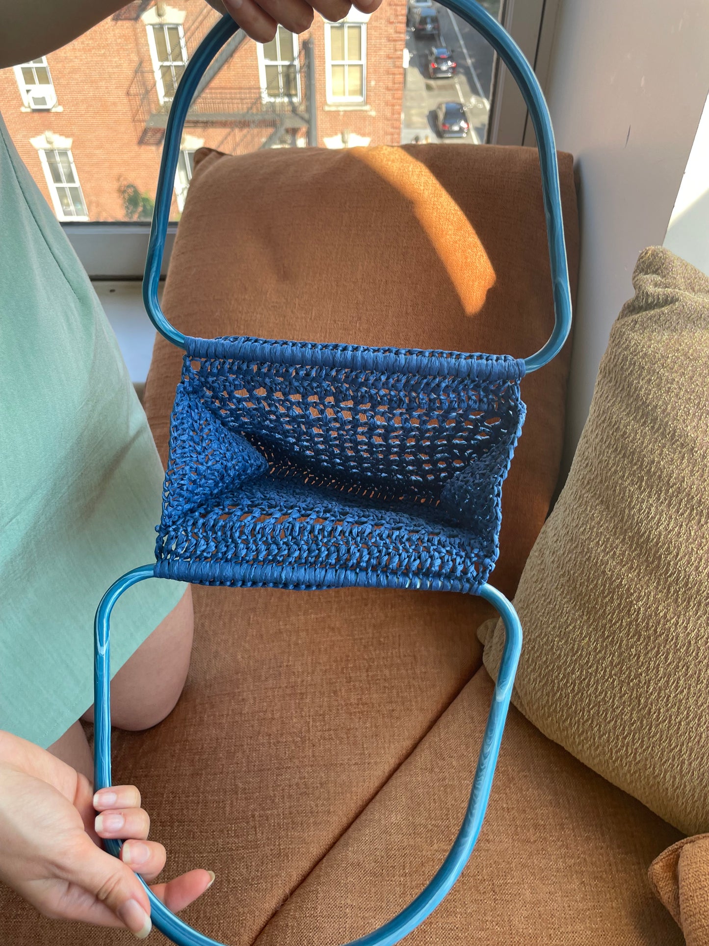 Model showing the inside of the blue market raffia bag