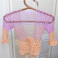 Detail of the surena crochet sirena crochet top in "dawn" purple and salmon