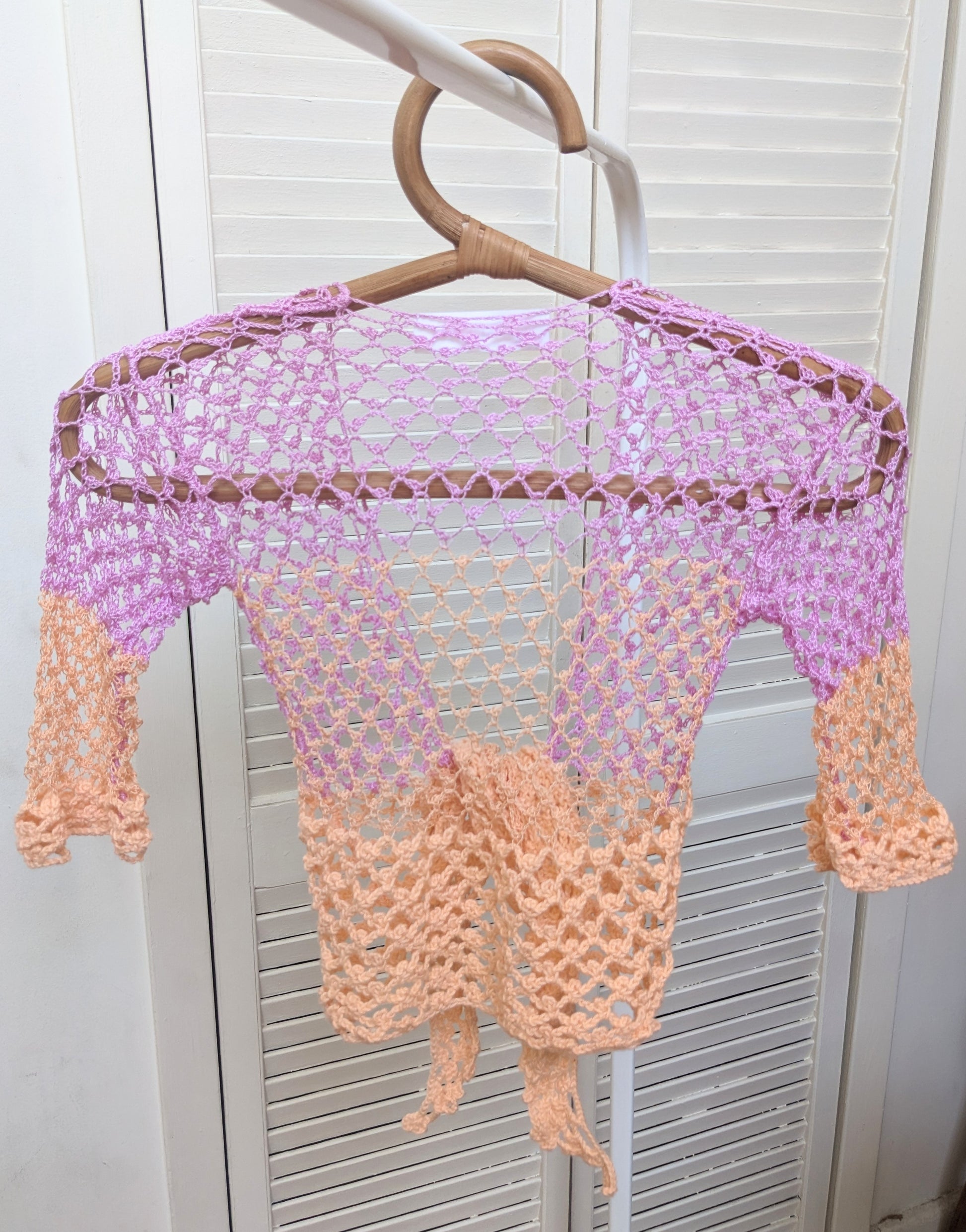 Detail of the surena crochet sirena crochet top in "dawn" purple and salmon