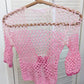 Detail of the Surena Crochet Sirena top in "kiss" pink color palette