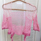 Detail of the Surena Crochet sirena crochet top in "kiss" pink color palette