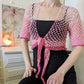 Model wearing the Surena crochet sirena crochet top in "kiss" pink color tones, handmade with cotton yarn