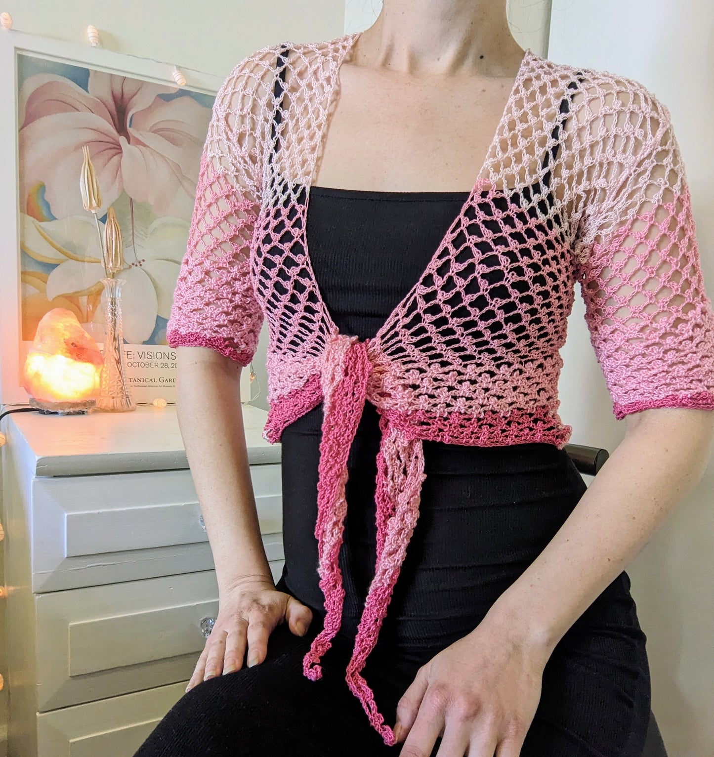 Model wearing the Surena crochet sirena crochet top in "kiss" pink color tones, handmade with cotton yarn