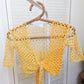Detail of the Surena crochet Sirena crochet top in "sunny" yellow color palette