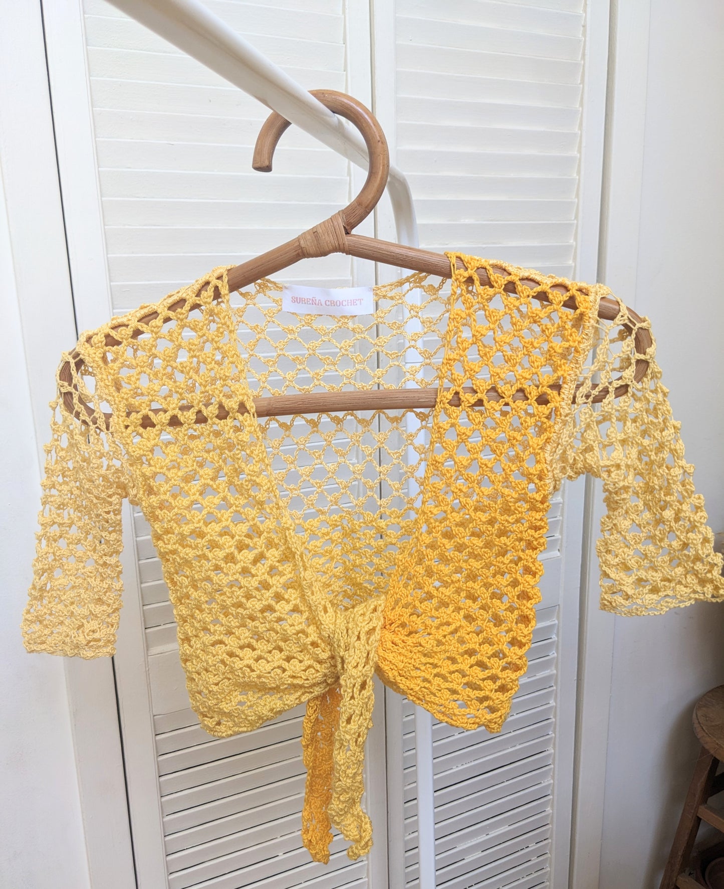 Detail of the Surena crochet Sirena crochet top in "sunny" yellow color palette