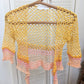 Detail of the Surena Crochet sirena crochet top in "sunset" yellow and pink color palette
