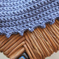Stitch detail of the surena crochet Estrella croptop in baby blue. A handmade and summery croptop made with cotton yarn.