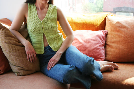 Model wearing the Surena Crochet nena vest crochet pattern in lime green, ideal for intermediate beginners 
