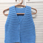 Detail of the surena crochet nena vest crochet pattern in baby blue, perfect for intermediate beginners 