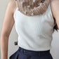 Model wearing the surena crochet Pecas cowl, an easy and wintery project suited for beginners and advanced beginners.