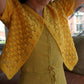 Model wearing the sunshine yellow crochet cardigan. 