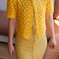 Model wearing the sunshine yellow crochet cardigan. 